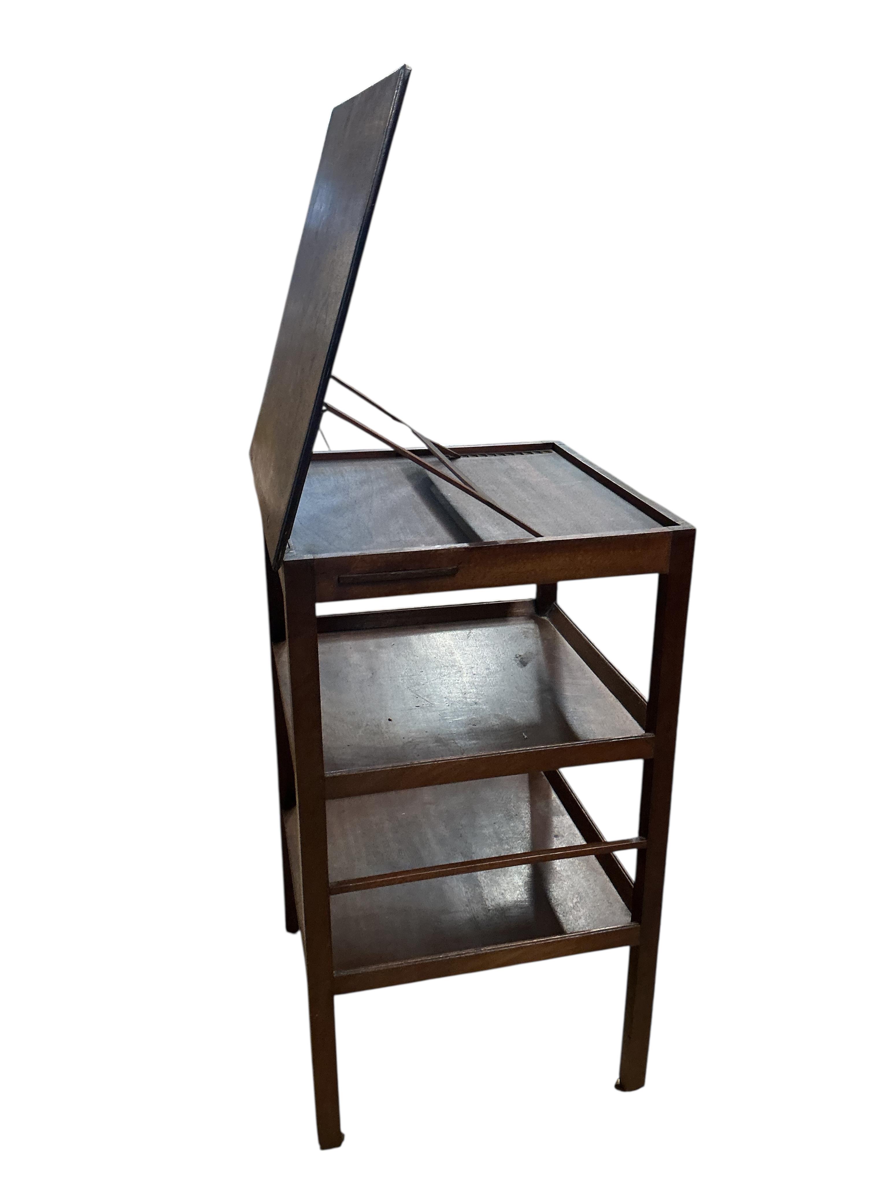 A George III whatnot with adjustable ratchet top, width 47cm, depth 47cm, height 85cm